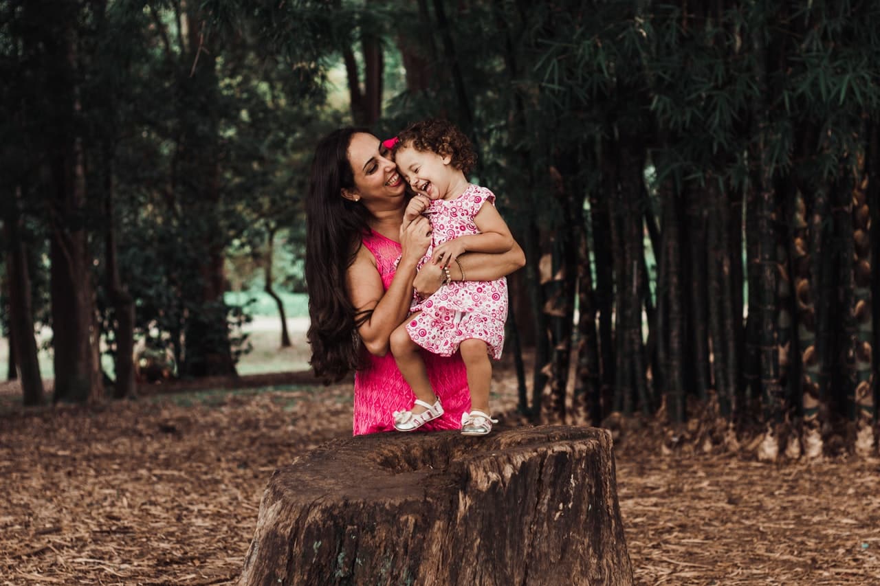 child and mother in forest